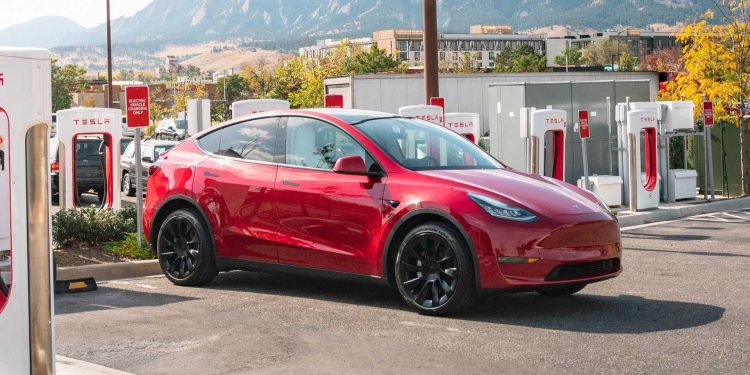 tesla model y charging at a tesla supercharging station 750x375 - Tesla's China-Made EV Deliveries Reach 72,115 in October, Slight 2.6% Dip from Previous Month
