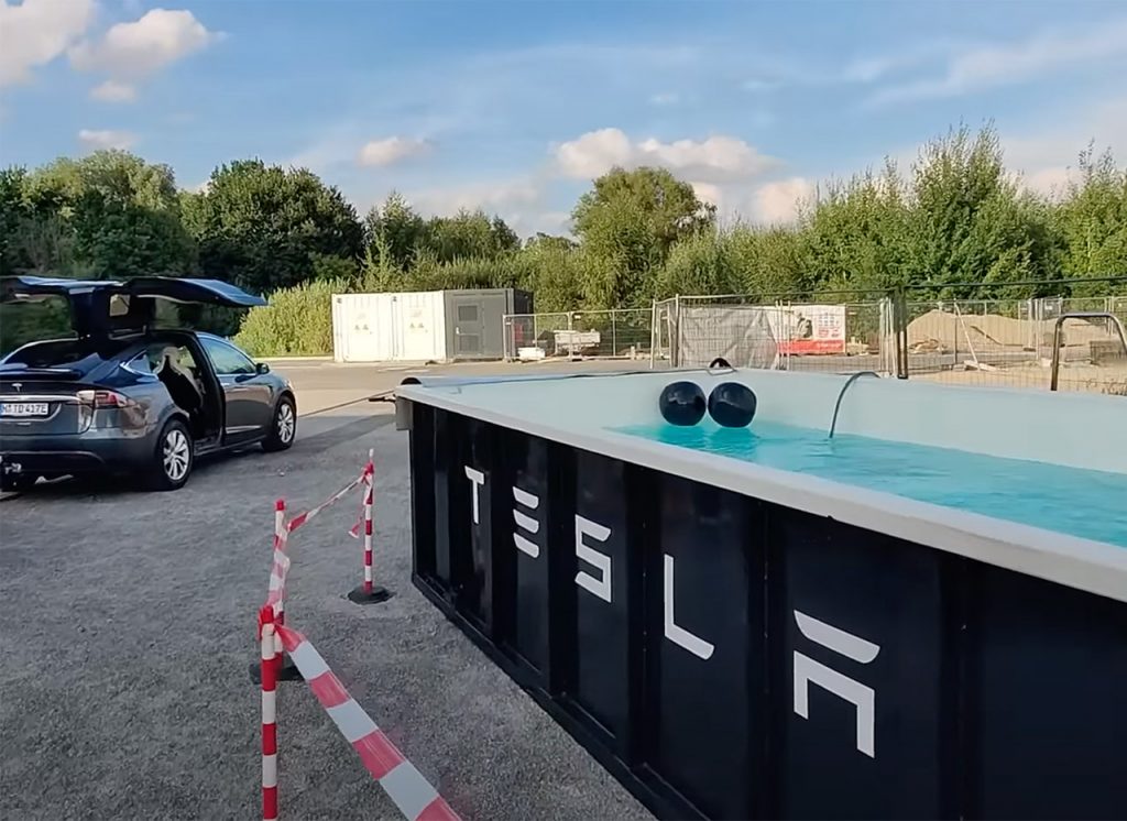 This Tesla supercharger station in Germany has a swimming pool in the sweltering weather