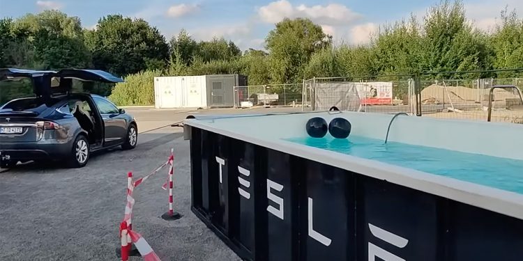 This Tesla supercharger station in Germany has a swimming pool in the sweltering weather