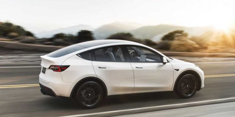 tesla model y white driving 750x375 - Tesla Model Y Long Range Delivery Estimates Moved to March-May 2023, Reflecting High Demand