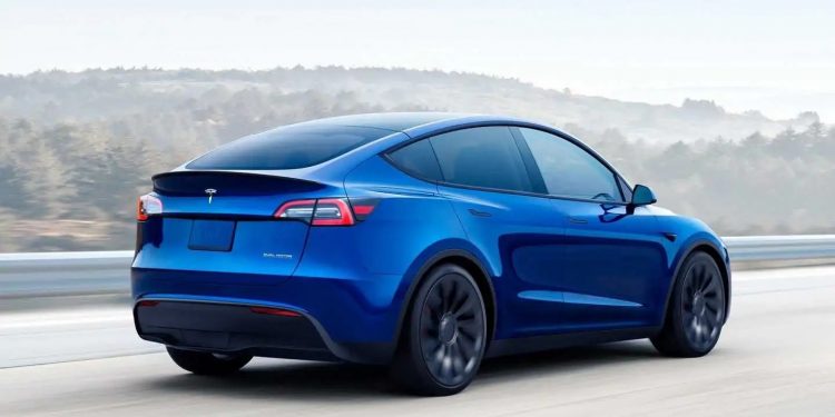 blue tesla model y driving 750x375 - Tesla's Upcoming Software Update to Include 'Tire Service Mileage' Feature for Easier Maintenance Tracking