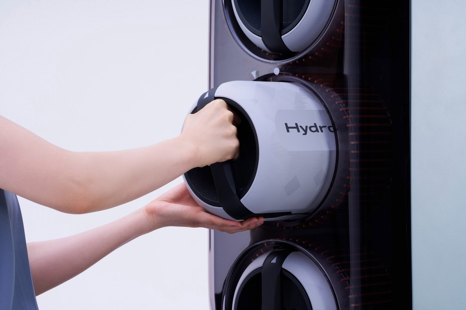 Toyota Unveils Portable Hydrogen Cartridges for Electric Vehicles, Offering Extended Range and Versatility