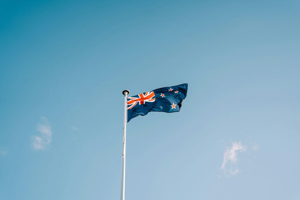 New South Wales Opens New Funding Round For EV Fleet Incentives a flag flying in the wind on a clear day