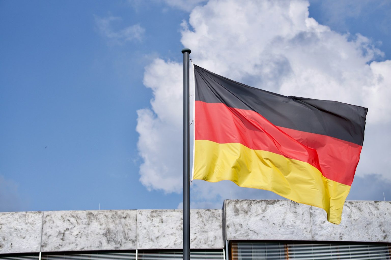 Germany Formalises Toll Exemption for Zero-Emission Trucks Until Mid-2031 a flag on a pole