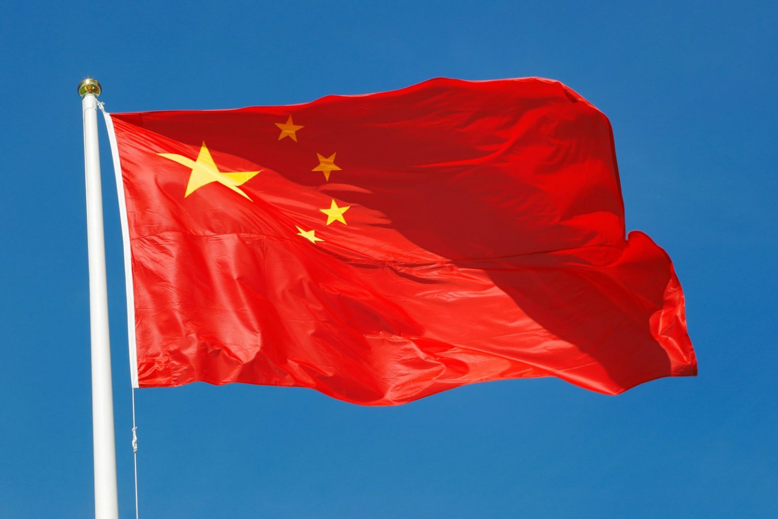 Chinese Researchers Report Solid-State Battery Breakthrough That Cuts Pressure Requirements waving flag of China