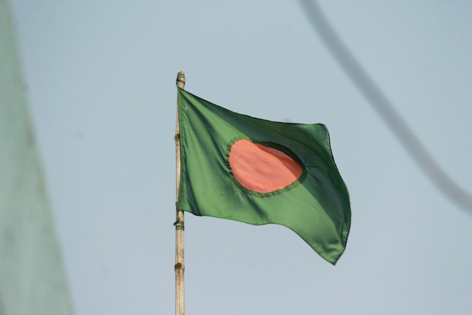a green flag on a pole