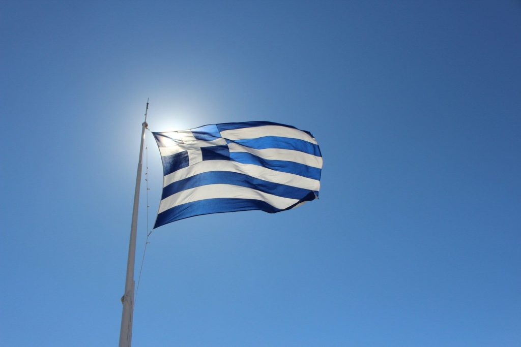 Greece Tightens E-Scooter Rules With Helmet, Insurance and Age Requirements blue and white flag