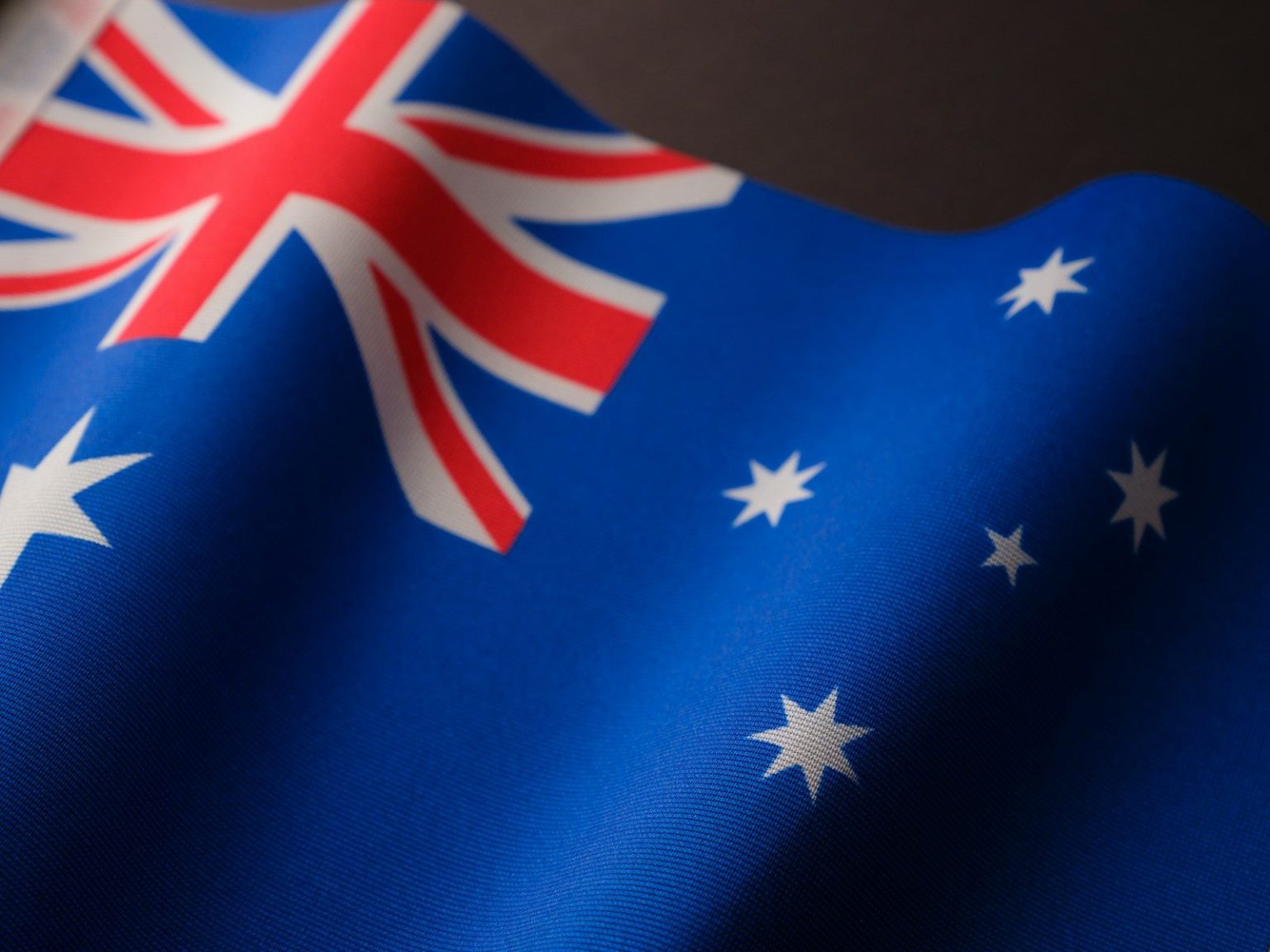 Australia Backs Smart Grid Projects With AU$30 Million, Including EV Charging and Vehicle-to-Grid Initiatives a close up of the flag of australia