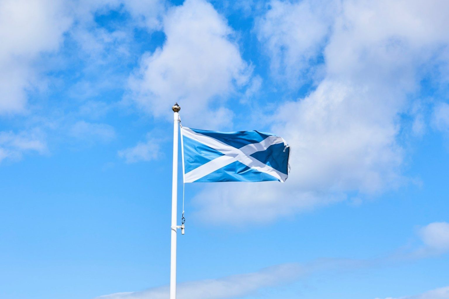 Scotland Allocates Nearly £2 Million to Support Zero-Emission Truck Transition a blue and white flag flying in the wind