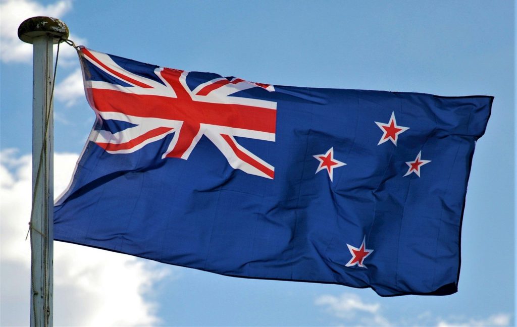 New Zealand Retains Clean Vehicle Standard With Revised Targets Planned for 2028 a blue and red flag