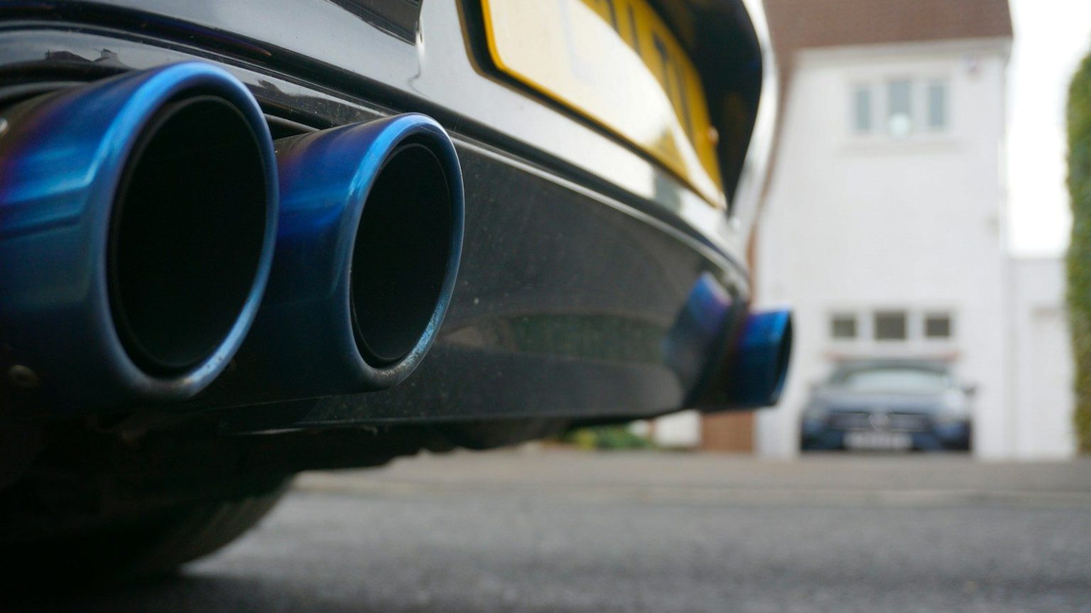 Close-up of blue exhaust pipes on a car