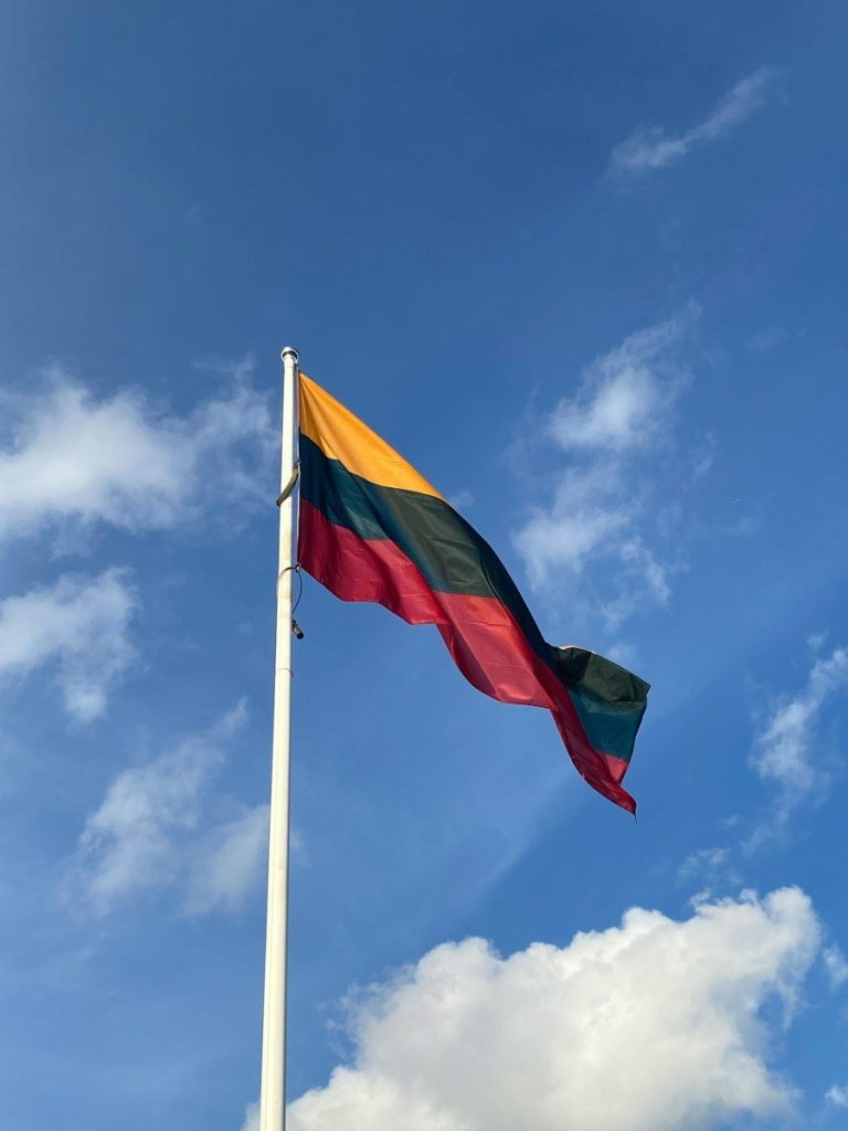 A flag is flying high in the sky