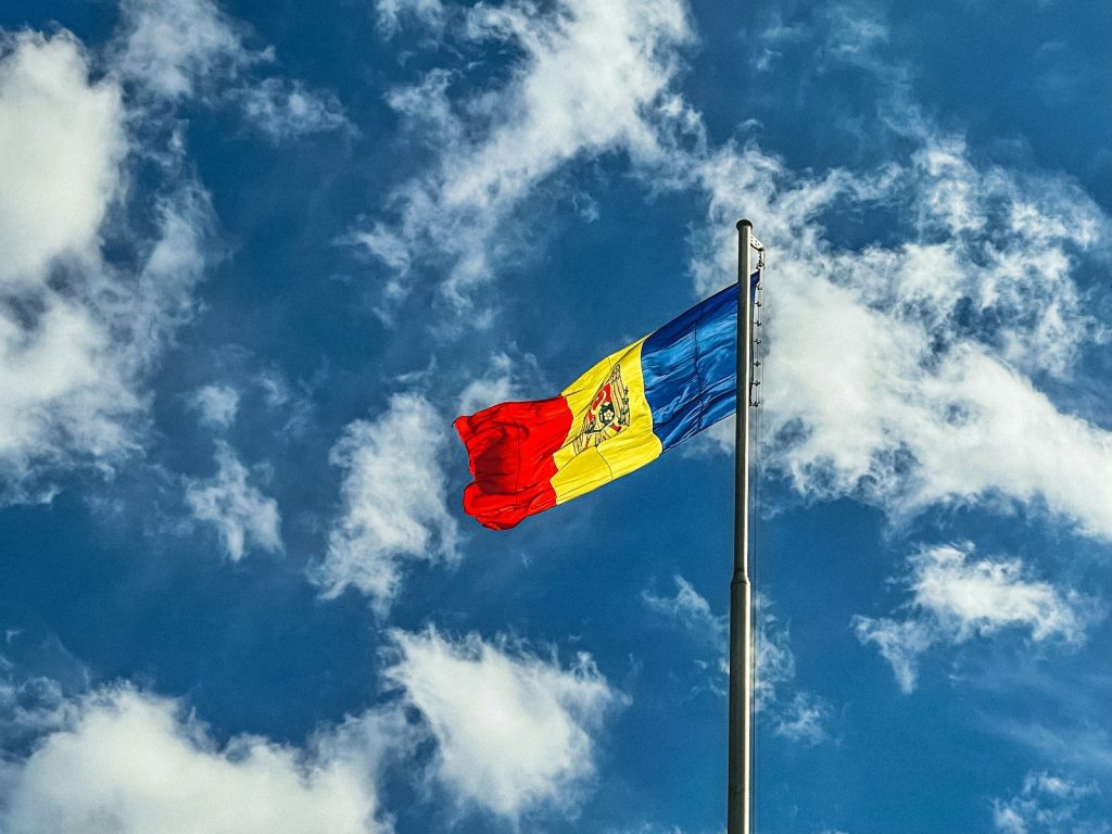 Moldova Targets 600 Public EV Charging Points and 15% Fleet Electrification by 2030 red blue and yellow flag under blue sky during daytime
